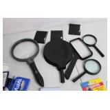 Assortment of Magnifying Glasses, Scissors, and Tools