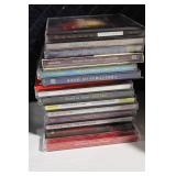 Collection of Cassette Tapes and CDs Featuring Holiday and Jazz Music