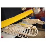 Partially Assembled Model Airplane Kit with Yellow Wing