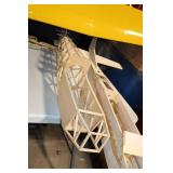 Partially Assembled Model Airplane Kit with Yellow Wing