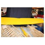 Partially Assembled Model Airplane Kit with Yellow Wing