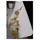 Diverse Collection of Home Decor Items Including Figurines and Wall Hangings