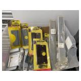 Large Collection of Door Hardware Including Latch Protectors and Strike Plates