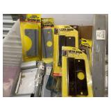 Large Collection of Door Hardware Including Latch Protectors and Strike Plates