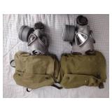 2 Vintage Finnish military gas masks, Suod 61T KRH ASC 12x30, with green canvas carrying bag.