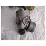 2 Vintage Finnish military gas masks, Suod 61T KRH ASC 12x30, with green canvas carrying bag.