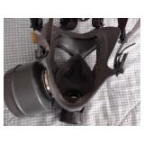 2 Vintage Finnish military gas masks, Suod 61T KRH ASC 12x30, with green canvas carrying bag.