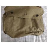 2 Vintage Finnish military gas masks, Suod 61T KRH ASC 12x30, with green canvas carrying bag.