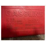 11 empty gas cans of various sizes