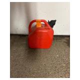 11 empty gas cans of various sizes