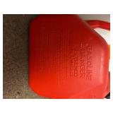 11 empty gas cans of various sizes