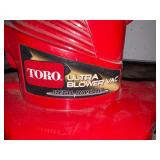 Black & Decker LE500 2HP electric lawn trimmer;  Toro plug-in Leaf Blower Ultra Blower Vac