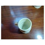 9 pottery pieces: Williamsburg Pottery 2 crocks; 2 pitchers; coffee cup; 3 Serving bowls; BBP coffee mug