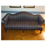 Chippendale style camel-back sofa with claw foot and striped upholstery. L 80” x H 31” x W 31.