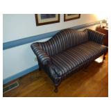 Chippendale style camel-back sofa with claw foot and striped upholstery. L 80” x H 31” x W 31.