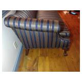 Chippendale style camel-back sofa with claw foot and striped upholstery. L 80” x H 31” x W 31.