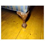 Chippendale style camel-back sofa with claw foot and striped upholstery. L 80” x H 31” x W 31.