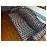 Chippendale style camel-back sofa with claw foot and striped upholstery. L 80” x H 31” x W 31.