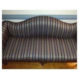 Chippendale style camel-back sofa with claw foot and striped upholstery. L 80” x H 31” x W 31.