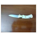 Machete with decorative sheath; 10-point Buck collectors knife by the Franklin Mint