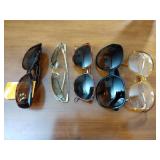 4 pairs of sunglasses, 1 eye glasses