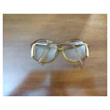 4 pairs of sunglasses, 1 eye glasses