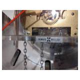 Mid-Century George Nelson for Howard Miller pendulum wall clock with transparent face.