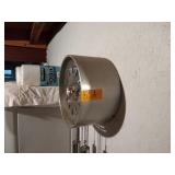 Mid-Century George Nelson for Howard Miller pendulum wall clock with transparent face.