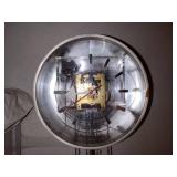 Mid-Century George Nelson for Howard Miller pendulum wall clock with transparent face.