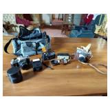 Canon AE-1 camera; Minolta Freedom GT; Hawkey Instamatic; Voigtlander Bessamatic 35mm SLR.