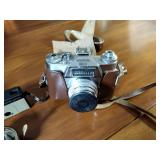 Canon AE-1 camera; Minolta Freedom GT; Hawkey Instamatic; Voigtlander Bessamatic 35mm SLR.