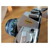 Canon AE-1 camera; Minolta Freedom GT; Hawkey Instamatic; Voigtlander Bessamatic 35mm SLR.