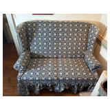 Blue country print wingback settee (loveseat) with ruffled skirt.  L 57” x H 40” x W 29” Bring help to move.