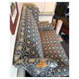 Blue country print wingback settee (loveseat) with ruffled skirt.  L 57” x H 40” x W 29” Bring help to move.