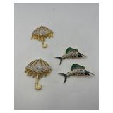 4 BOLD Elegance brooches: 2 Swordfish 2 ¾” l x 1 ¼”t; 2 pave’ rhinestone umbrella brooches 2 ¾” t