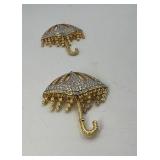 4 BOLD Elegance brooches: 2 Swordfish 2 ¾” l x 1 ¼”t; 2 pave’ rhinestone umbrella brooches 2 ¾” t