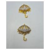 4 BOLD Elegance brooches: 2 Swordfish 2 ¾” l x 1 ¼”t; 2 pave’ rhinestone umbrella brooches 2 ¾” t