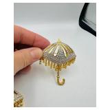 4 BOLD Elegance brooches: 2 Swordfish 2 ¾” l x 1 ¼”t; 2 pave’ rhinestone umbrella brooches 2 ¾” t