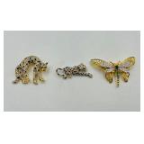 Vintage brooches: 2 Leopard gold-tone black enamel/pave rhinestones w/ green eyes, 1 dragon fly or butterfly