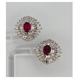 2 pierced earrings, one pear cut dangle post,  stud with red gemstone center surrounded by rhinestones