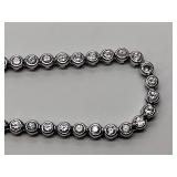 .925/sterling silver necklace with blue center stone and CZ drop pendant