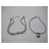 2 pearl necklaces. 17” and 20” 1 is marked Bold Elegance