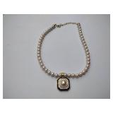 2 pearl necklaces. 17” and 20” 1 is marked Bold Elegance