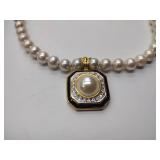 2 pearl necklaces. 17” and 20” 1 is marked Bold Elegance