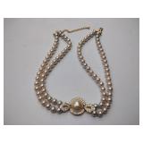 2 pearl necklaces. 17” and 20” 1 is marked Bold Elegance