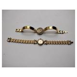 Oleg Cassini 32-420 quartz watch. Quartz watch with plain band and rhinestones on the dial face.