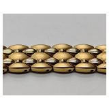 Oleg Cassini 32-420 quartz watch. Quartz watch with plain band and rhinestones on the dial face.