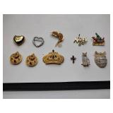 8 broaches, 1 necklace pendant, and 1 set of earrings