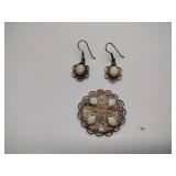 7 vintage broaches, 3 sets of earrings, and 1 bracelet