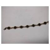 7 vintage broaches, 3 sets of earrings, and 1 bracelet